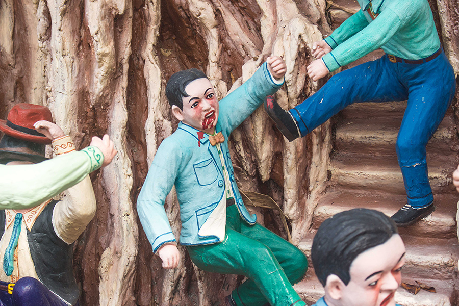 Statue in Haw Par Villa being kicked down by someone