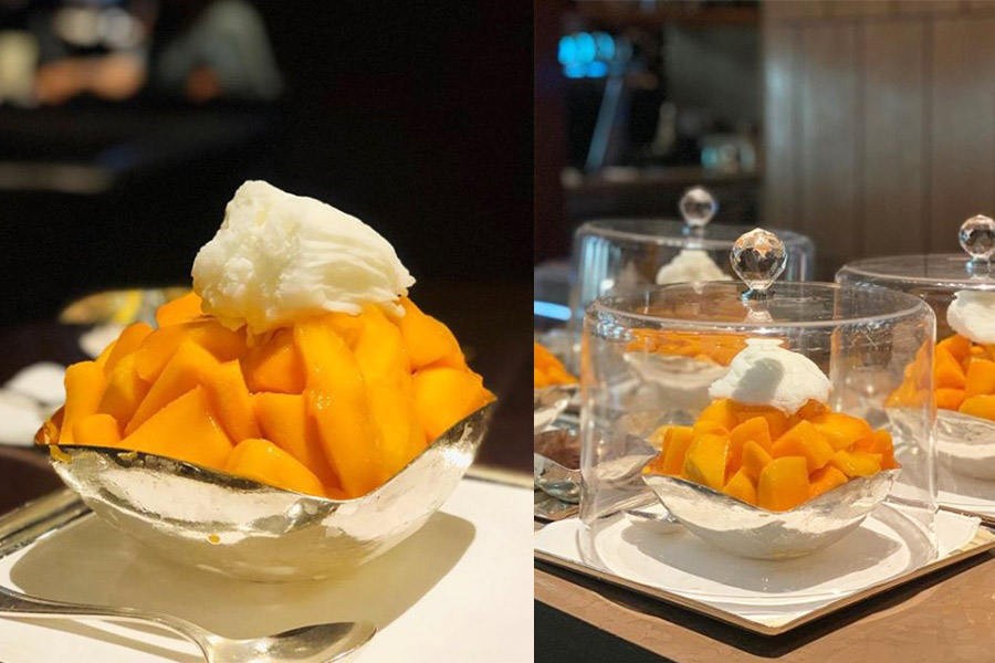 A bowl of Jeju Apple Mango Bingsu - chunks of apple mango topped with some shaved milk