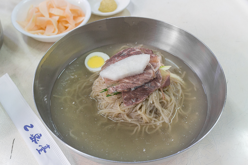 A bowl of Pyongyang Naengmyeon in Eulmidae, 50 year old store in Seoul