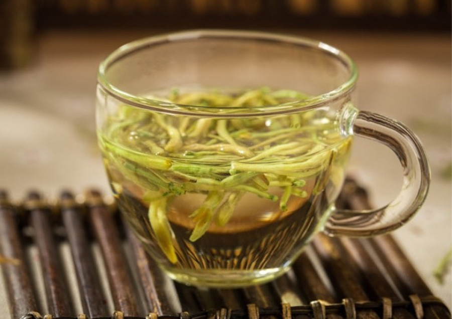 A glass cup of honeysuckle tea