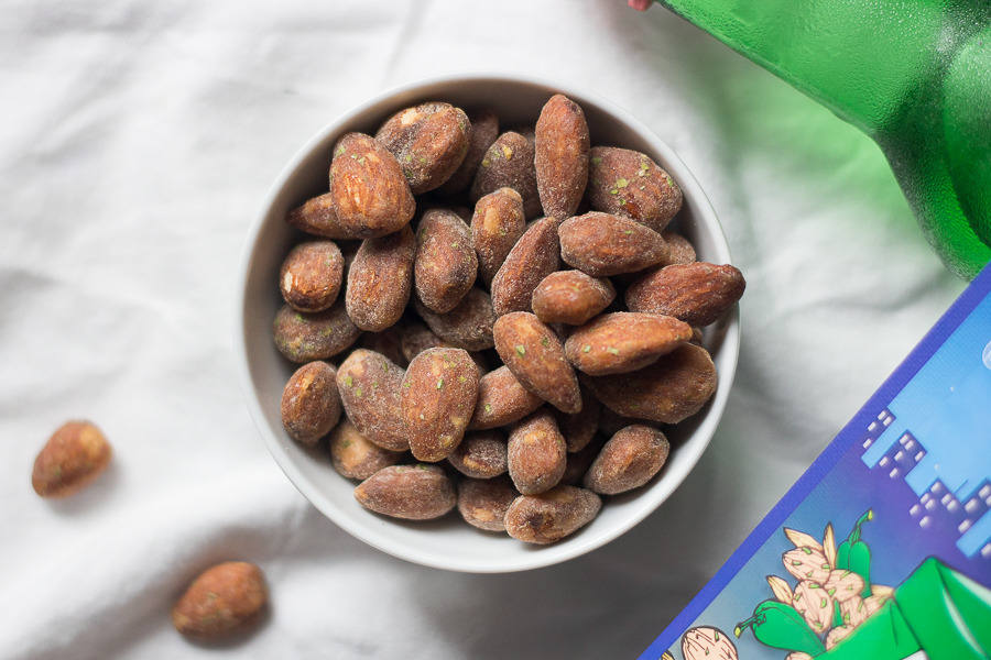 A bowl of Tom's Farm Cheongyang Mayo Almonds with green tiny specks in the almonds