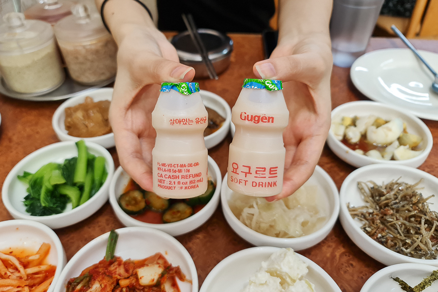 Korean Yoghurt Drink with side dishes as the background