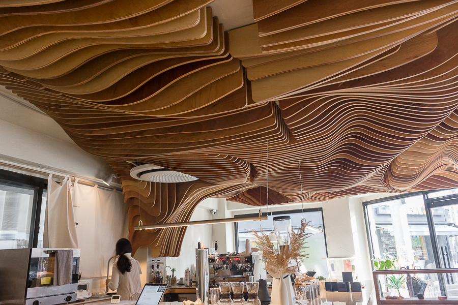 Wave like looking ceiling of Perception Coffee near Hapjeong made using wood elements