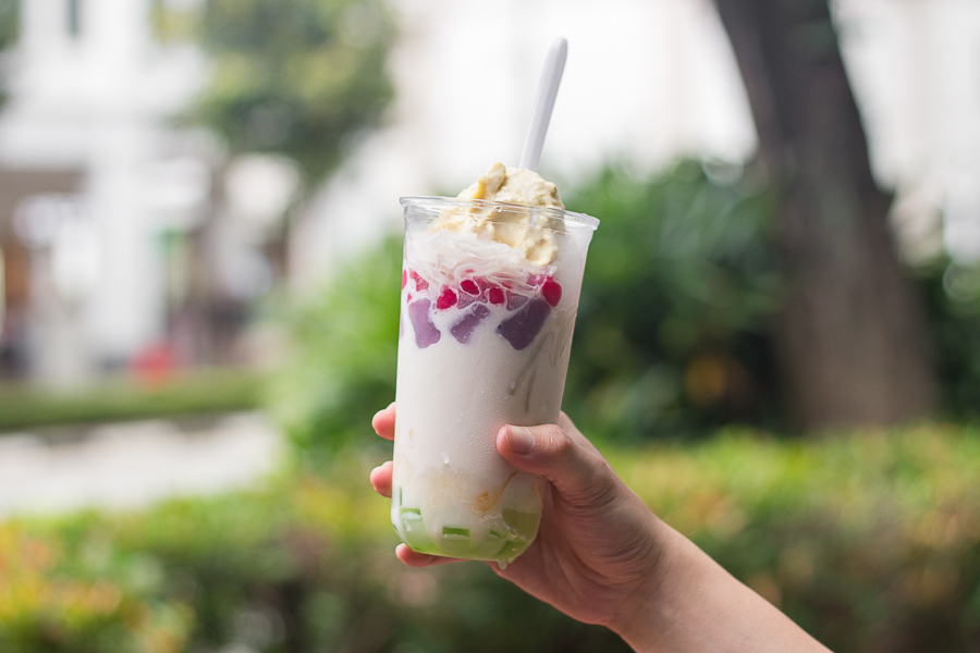 A cup of Vietnamese dessert with different laters such as red ruby and durian