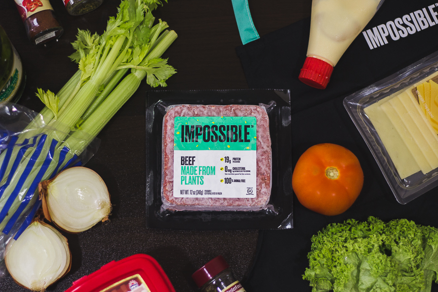 A packet of Impossible™ Beef Made From Plants surrounded by common kitchen food and items