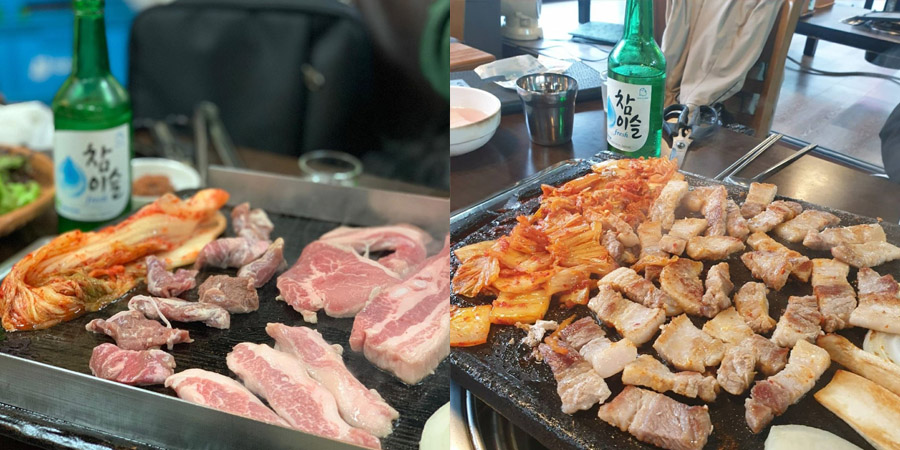 Korean BBQ with Bottles of Soju at the back, with grilled kimchi and pork belly on the grill