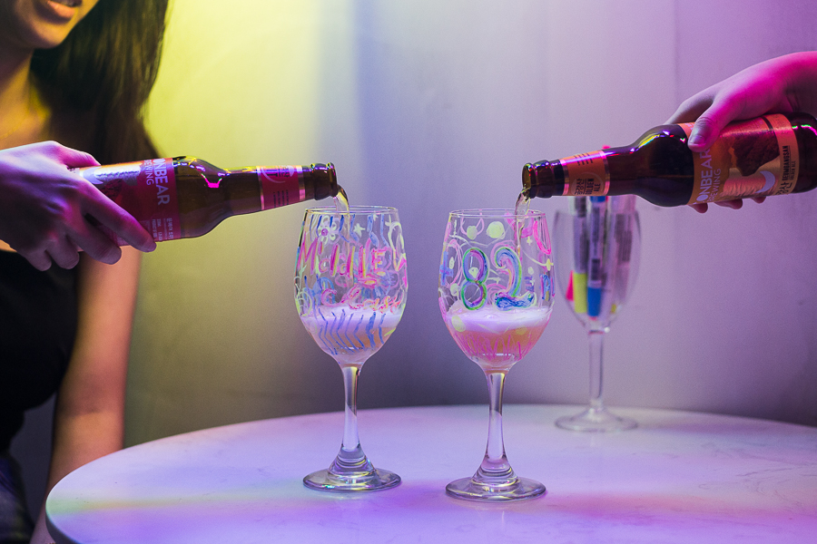 Pouring of craft beers into wine glasses