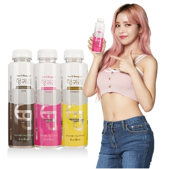 Bottles of Ever Bikini Diet Oats Shake with a model holding one promoting it