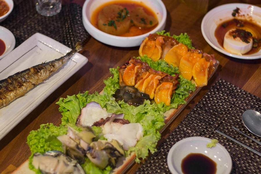 A plate of assorted seafood such as abalone, octopus. sea cucumber and sea squirt in a Singapore restaurant