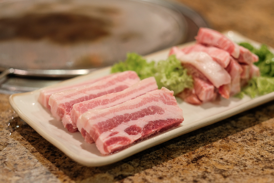 A plate of various pork cuts for BBQ at Seoul Restaurant