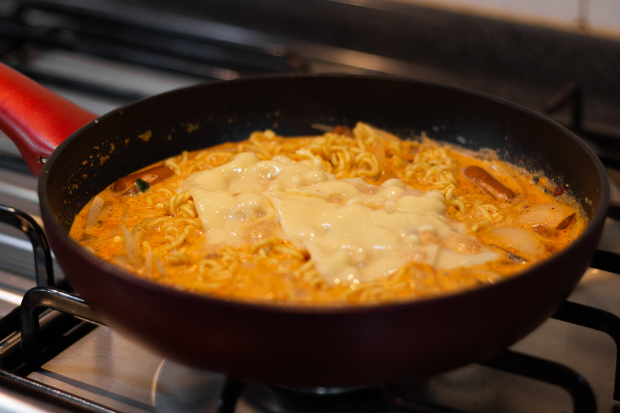 Adding Sliced Cheese to the Rose Shin Ramyun