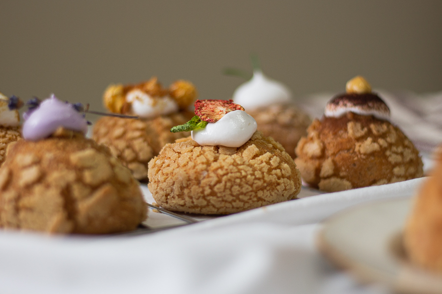Strawberry Basil Choux Puff in focus amongst other flavoured choux puffs