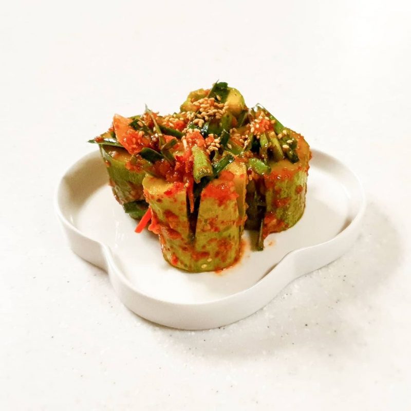 Stuffed Cucumber Kimchi served on a clover shaped plate