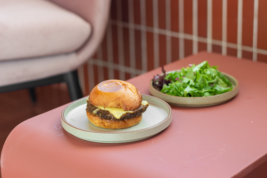 A Rendang Wagyu Beef Burger served with a side salad