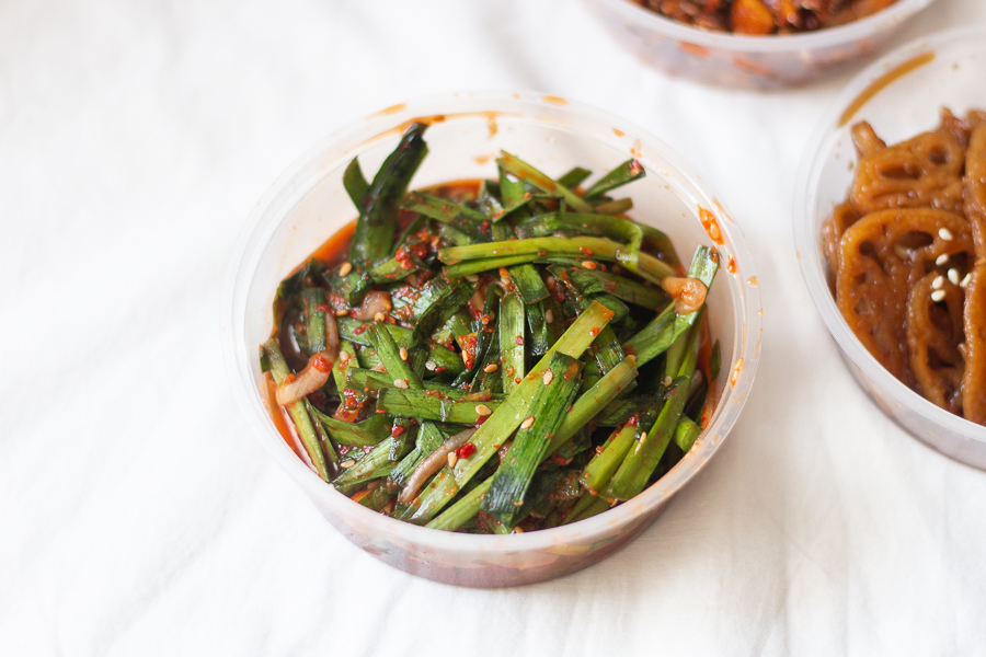 A container of Chive Kimchi (Buchu Kimchi)