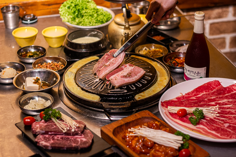 Food at Wang Dae Bak on a table with different meat cuts