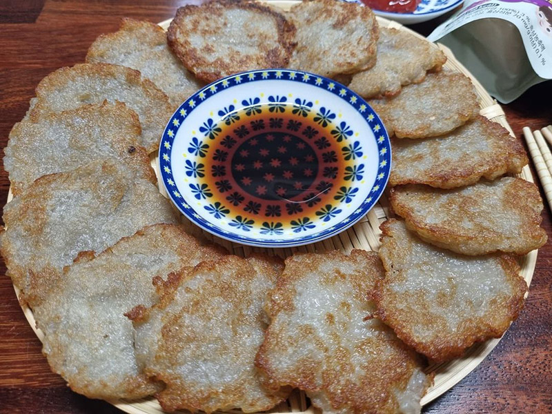 Korean potato pancakes (gamjajeon) with a dipping sauce in the middle