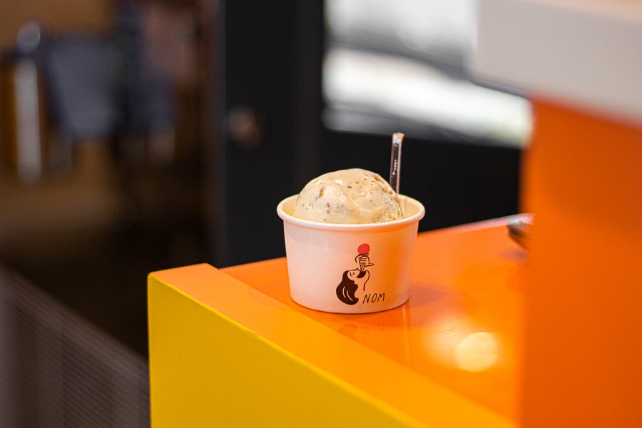 A single scoop of blue cheese and walnut praline gelato at NOM Gelato