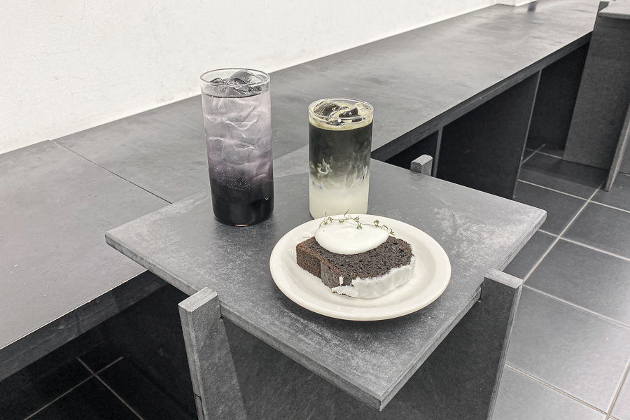 A black pound cake and two black & white drinks