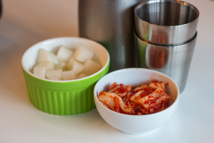 A bowl of kimchi and cubed radishes