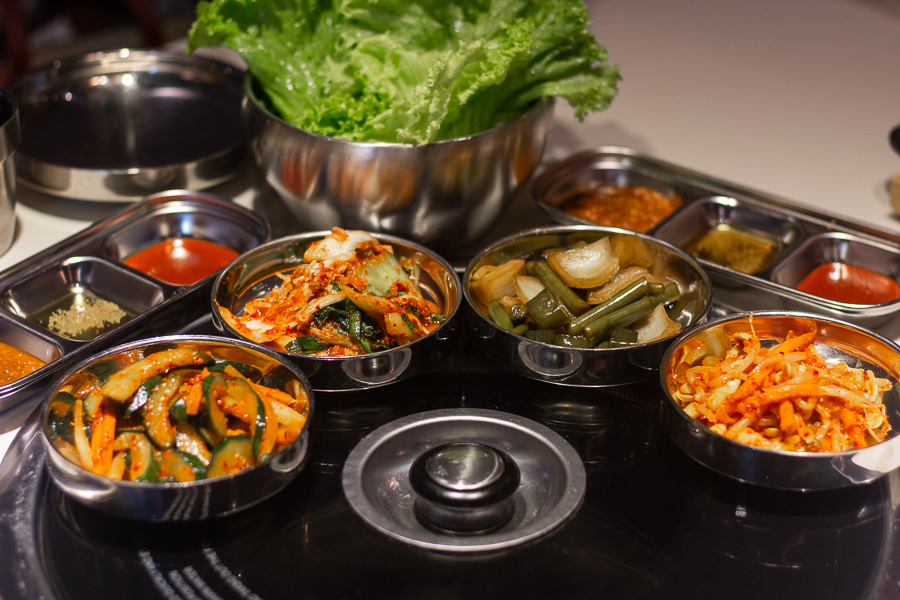 Side Dishes (Banchan) such as Kimchi, Beansprouts and Cucumber at Omma Korean BBQ