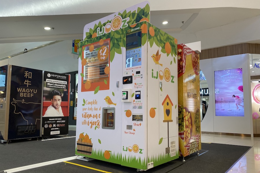 An orange juice vending machine in Thomson Plaze