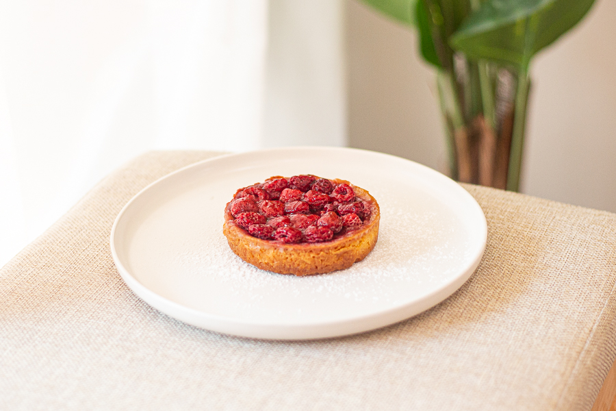 A raspberry tart on a plate