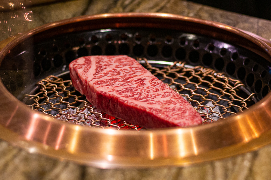 Grilling of Striploin over Charcoal Fire