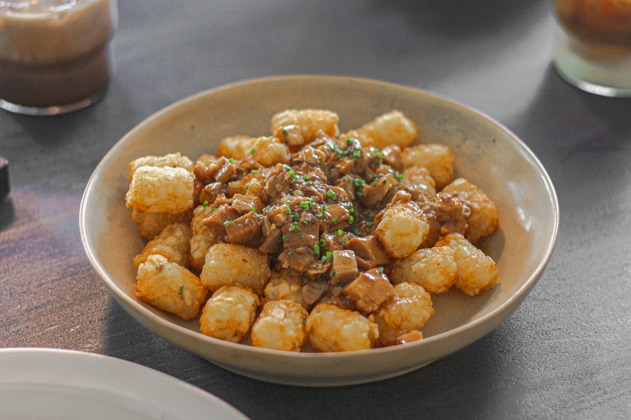 tater tots with minced braised meat on top