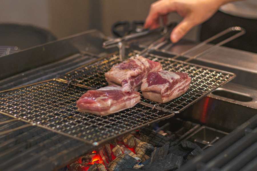 Grilling of Pork Belly over Charcoal