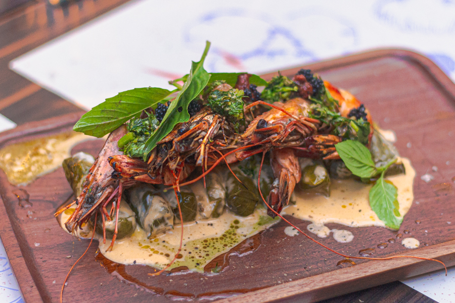 Turkish dolma with laksa-inspired sauce topped with pan-seared French prawns