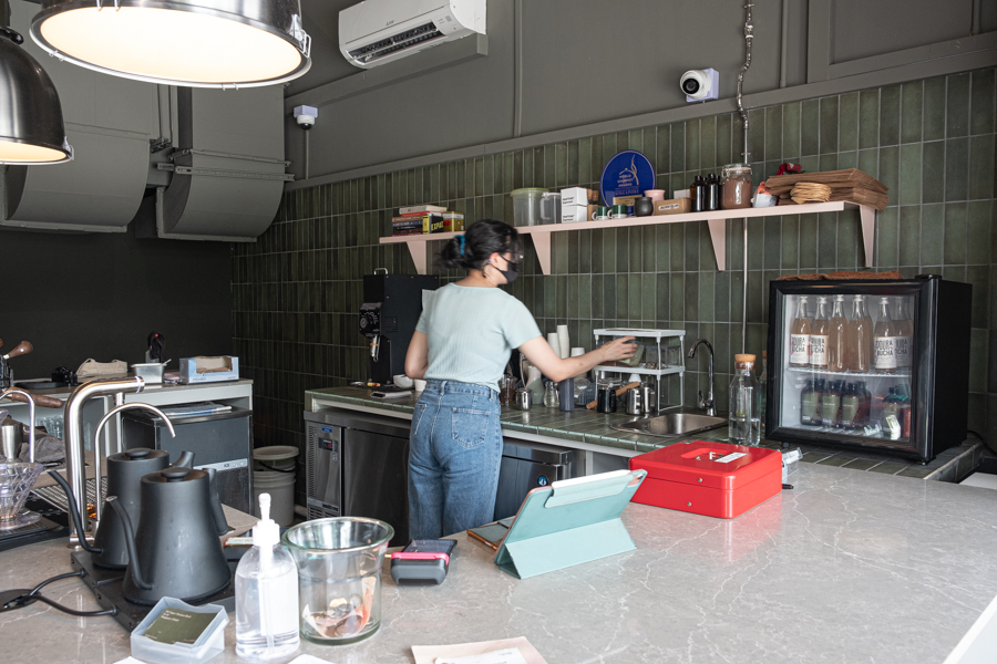 A barista making matcha at the coffee bar in State of Affairs cafe in Upper Thomson
