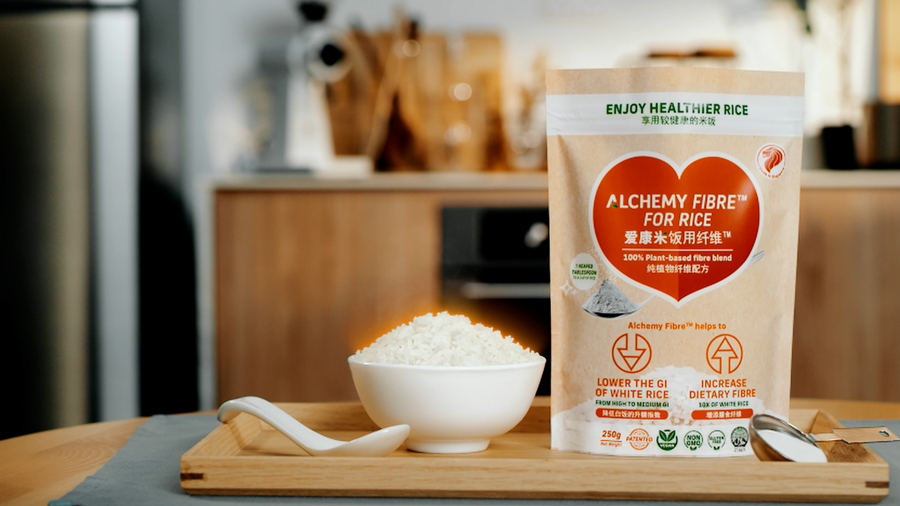 A bag of Alchemy FoodTech Alchemy Fibre beside a bowl of rice 