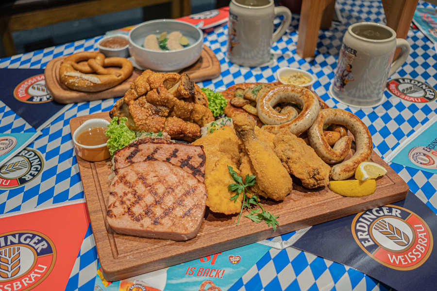 The full Brotzeit Oktoberfestplatte with pork knuckle, sausages, fried chicken and more