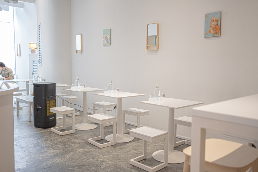 The white themed interior of Cafe Gui