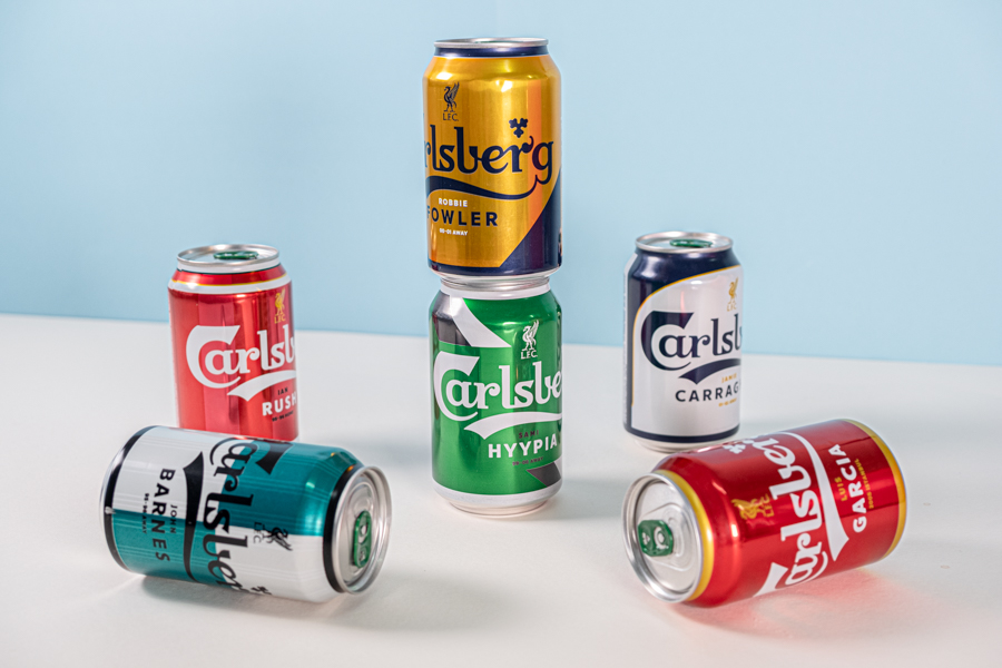 Six Carlsberg beer cans in a limited edition design of Liverpool Football Club jerseys