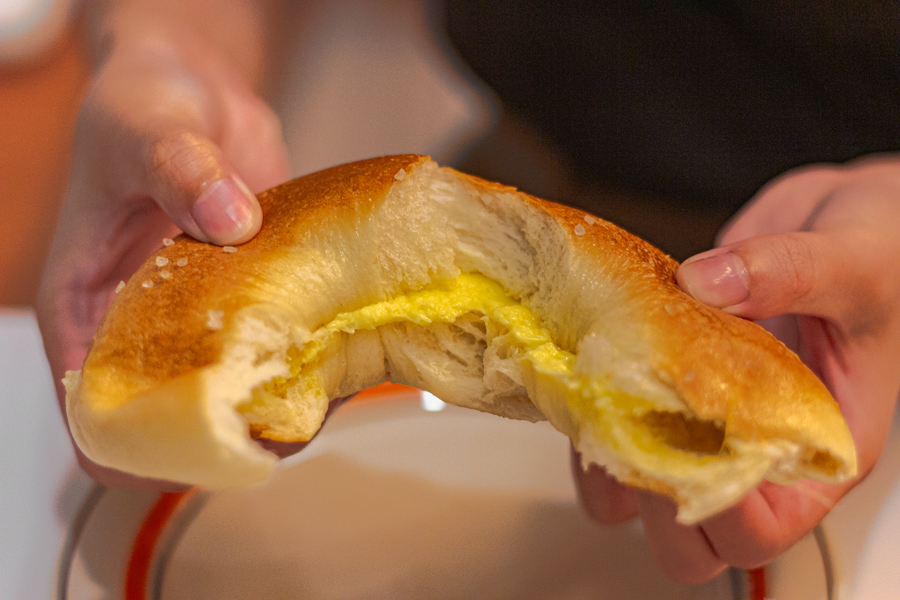 A cross-section of a Korean bagel with butter