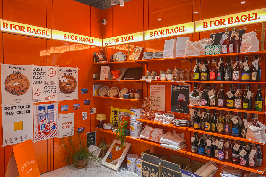 A retail corner selling B For Bagel merchandise and other dry goods