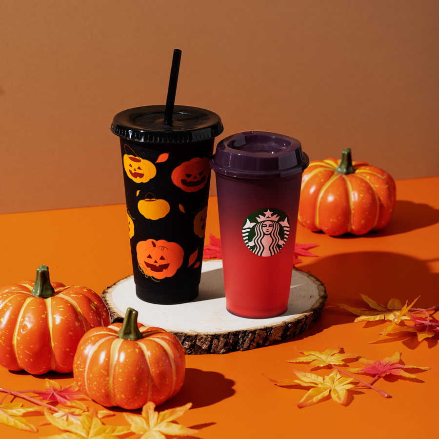 Two black and orange themed Starbucks reusable cups for Halloween