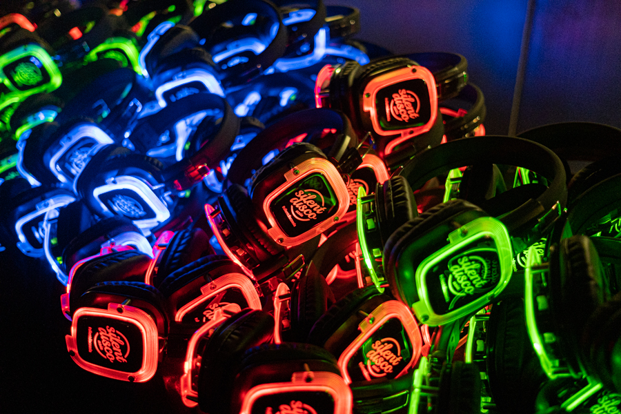 A table stocked with wireless bluetooth headphones for the Silent Disco