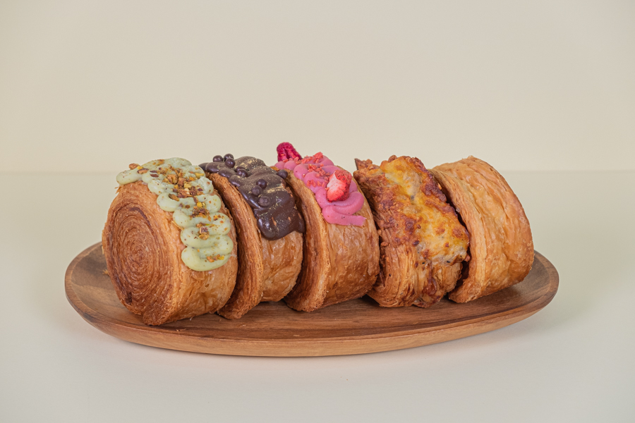 A lineup of five viral circular croissants by Swish Rolls bakery