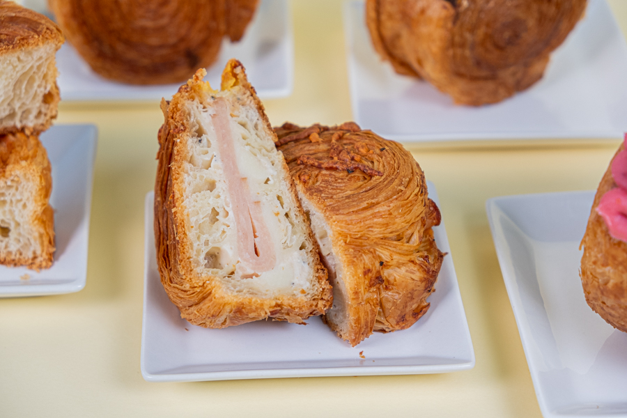 A diagonal cross section of a savoury ham and cheese croissaint by Swish Rolls bakery