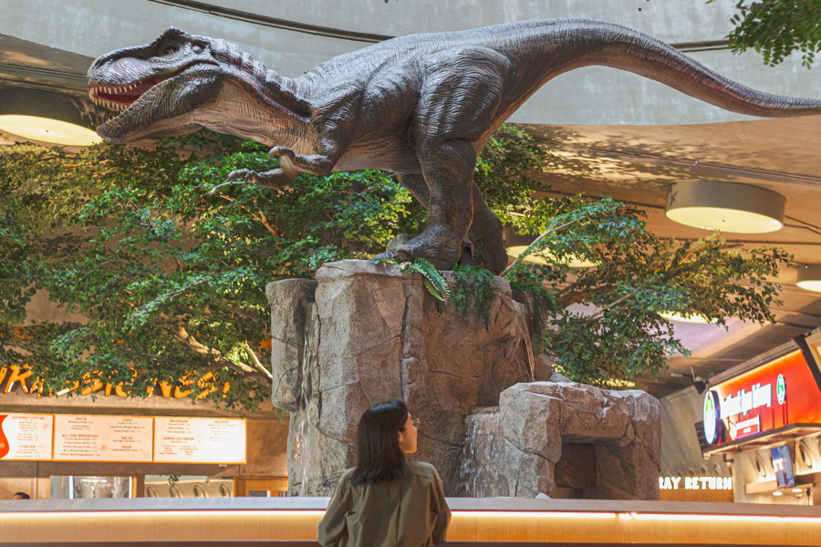 A T.rex replica in the center of the Jurassic Nest Food Hall