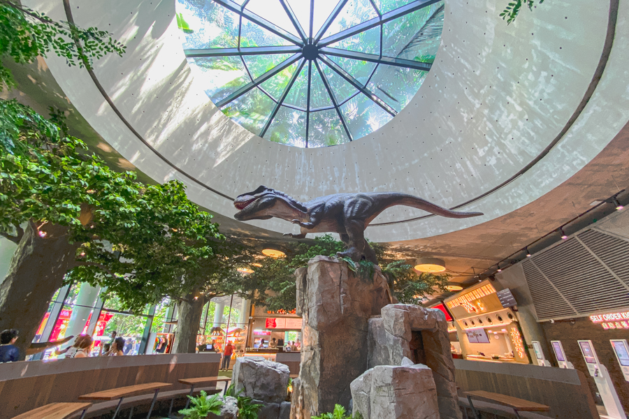 A T.rex replica in the center of the Jurassic Nest Food Hall