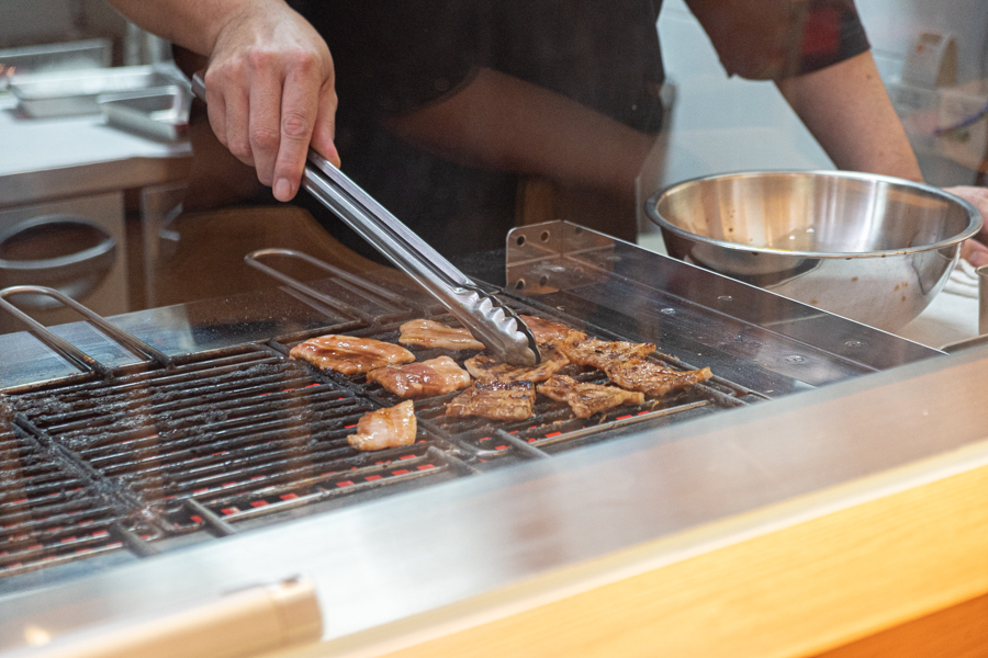 The pork being grilled