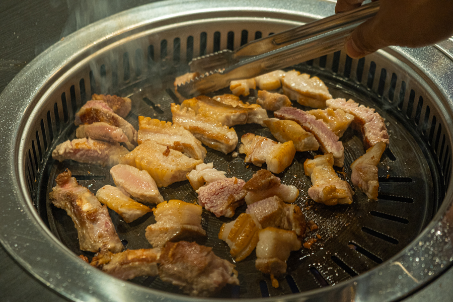 Pork being grilled