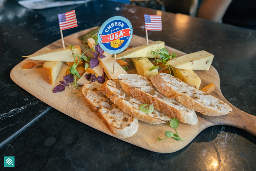 Black Marble's Artisan U.S Cheese Platter served with Dried Fruit, Pickle & Baguette