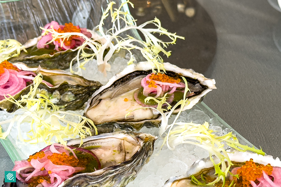 Fresh Jumbo Canadian Oyster with Salsa Taquera, Pickled Shallots and Tobiko