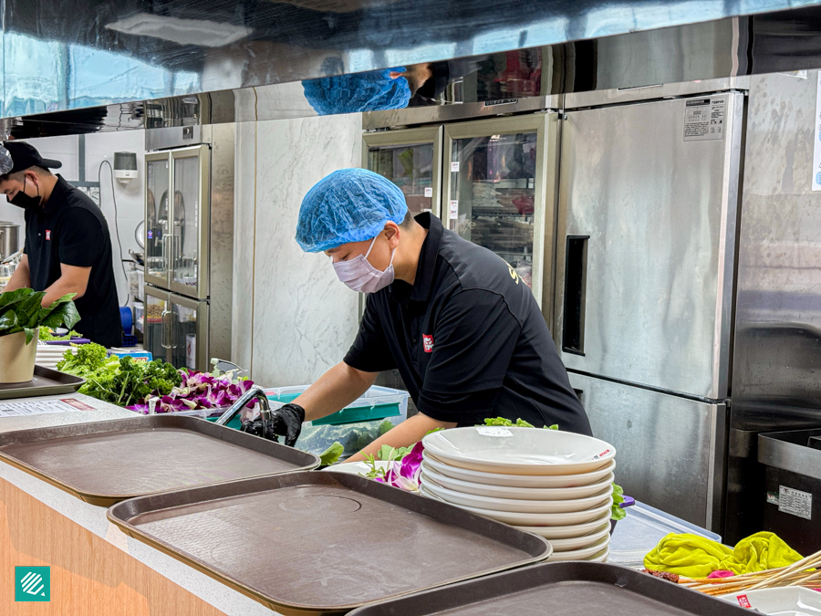 Staff preparing hotpot ingredients