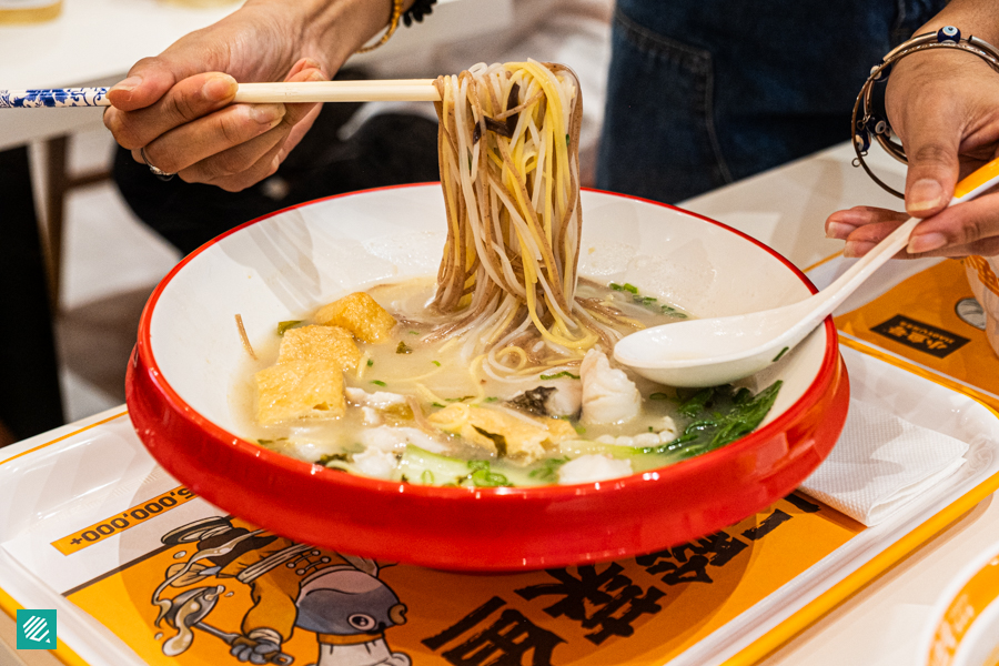 Sauerkraut Black Fish Five Grain Rice Noodles in Golden Broth 